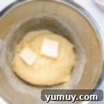 Homemade Krispy Kreme Glazed Donuts 7 butter in a mixing bowl.