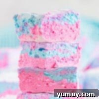 Spun Sugar Pillows 4 Featured image of a single cotton candy marshmallow, showcasing its delicate colors and fluffy texture.