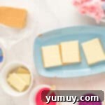 Cloud Nine S'mores 5 white chocolate squares on top of graham crackers on a blue plate