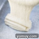 eggnog sheet cake batter poured into a greased 9x13 pan.