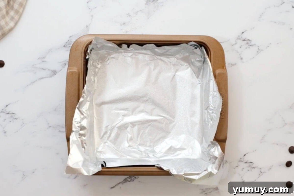 a square baking pan lined with foil and sprayed with nonstick spray.