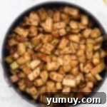 Spice-coated apples transferred to a 6-inch springform pan, ready for the crisp topping.