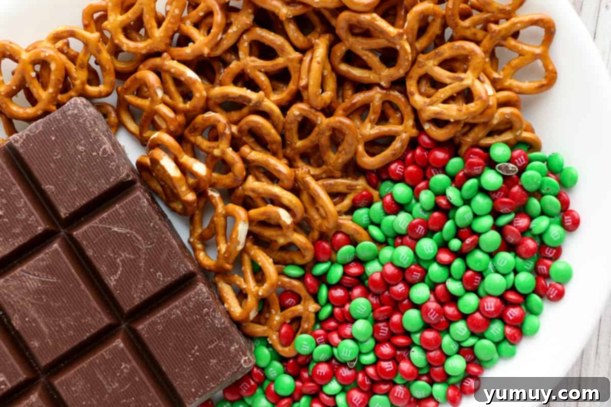 Festive Pretzel Bark 3 Step-by-step image showing how to make M&M chocolate pretzel bark, with melted chocolate and pretzels in a bowl.