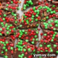 Festive Pretzel Bark 4 Featured image of festive M&M pretzel bark pieces, colorful and tempting.