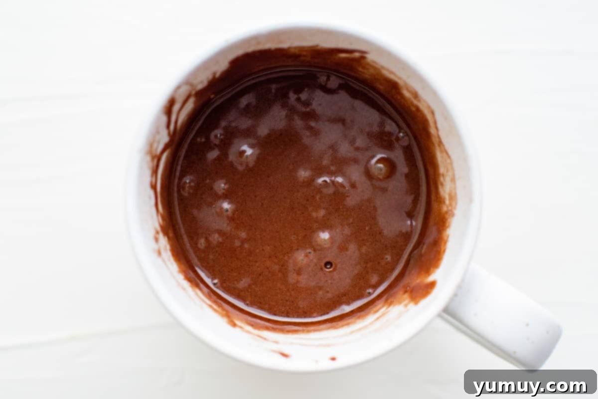 brownie batter in a mug, before microwaving