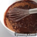whisking brownie batter