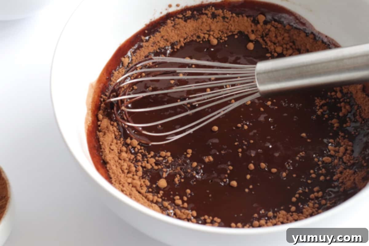 whisking brownie batter