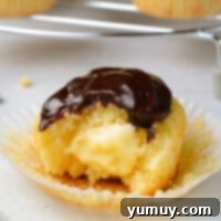 Inside of a Boston cream pie cupcake with rich custard filling.