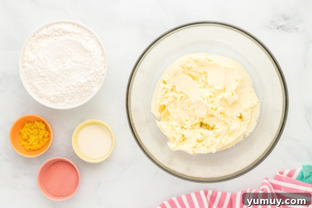 Mixing the dry flour mixture into the wet butter, sugar, egg, and vanilla batter in a large bowl.