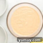 Vibrant Strawberry Lemon Cake 8 peach colored cake batter in a glass bowl.