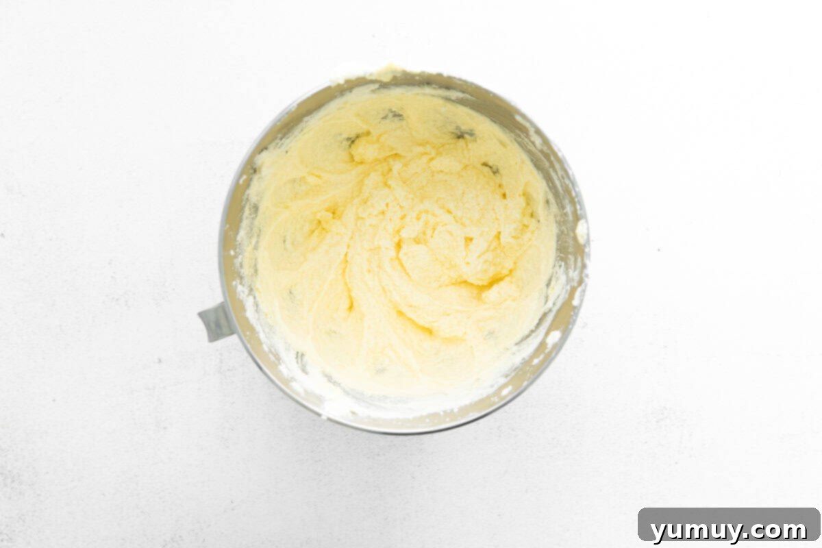 thick cake batter in a stainless mixing bowl.