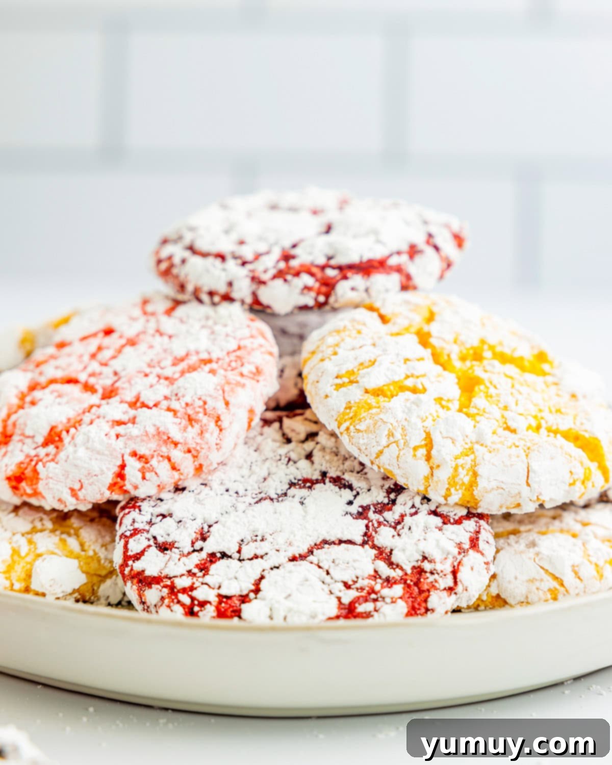 Cool Whip Cloud Cookies 3 Side view of perfectly stacked Cool Whip cookies on a plate, showcasing their inviting texture.