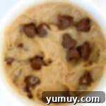 Decadent Peanut Butter Mug Delight 6 Peanut butter chocolate chip mug cake batter in a white mug.