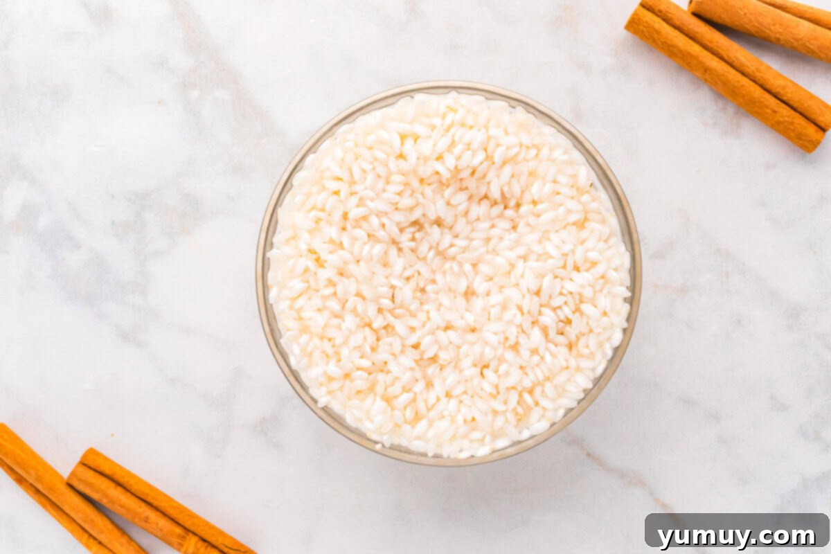 rinsed uncooked arborio rice in a glass bowl.