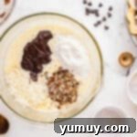 German Chocolate Coconut Pecan Delight Pie 11 Folding chocolate, coconut, pecans, and flour into whipped eggs in a glass bowl.