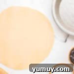 German Chocolate Coconut Pecan Delight Pie 6 Rolled-out pie crust on a work surface.