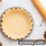 German Chocolate Coconut Pecan Delight Pie 7 Crimped pie crust in a pie pan.