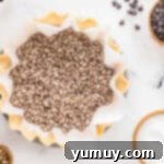 German Chocolate Coconut Pecan Delight Pie 8 Parchment paper and pie weights over a crimped pie crust in a pie pan.