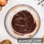 German Chocolate Coconut Pecan Delight Pie 9 Melted chocolate in a glass bowl.