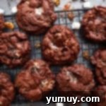 Overhead view of baked rocky road cookies on a wire cooling rack.