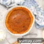 Vinegar Pie A Slice of Humble Pie: The Unexpected Delight 8 Baked vinegar pie in a white pie pan.