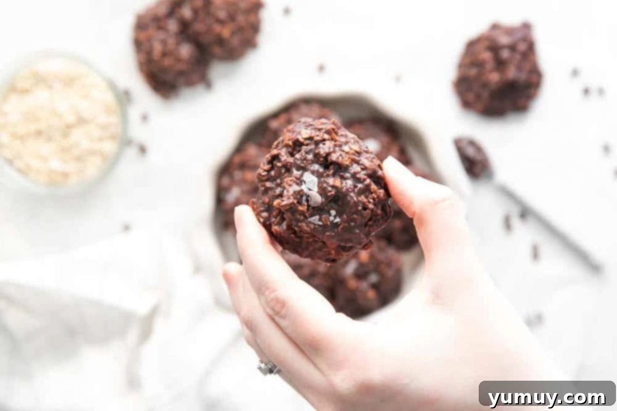 holding a nutella no bake cookie topped with flaky salt.