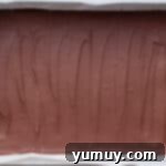 Peanut Butter Dream Bars 11 chocolate fudge in a baking pan.