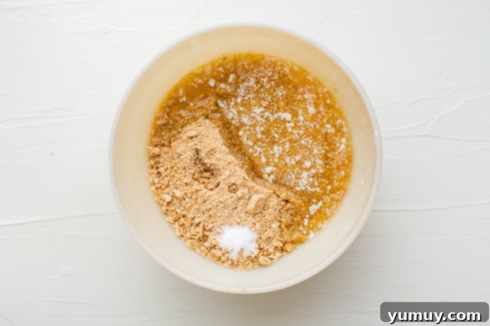 Peanut Butter Dream Bars 13 a white bowl with a mixture of flour and sugar.