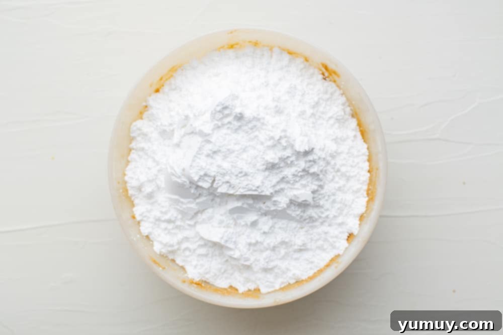 Peanut Butter Dream Bars 15 a bowl of white powder.