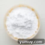 Peanut Butter Dream Bars 8 a bowl of white powder.