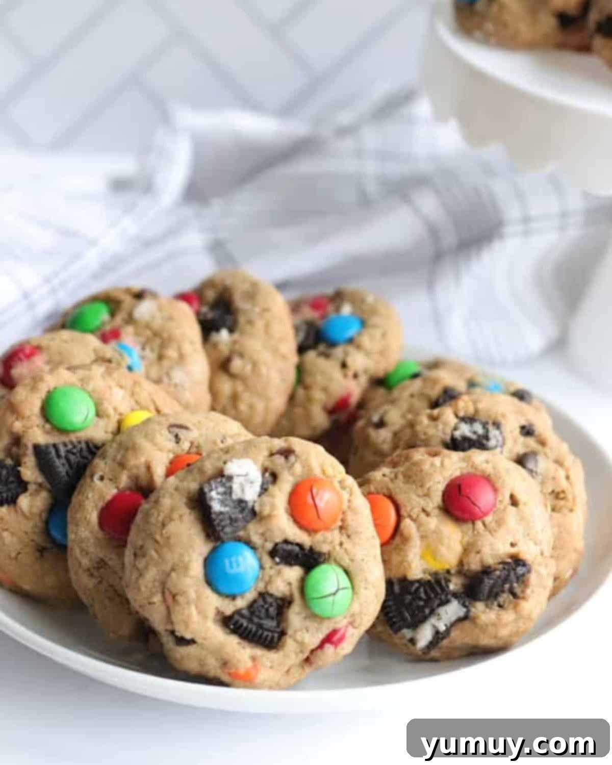 A plate full of freshly baked Oreo monster cookies, highlighting their soft and chewy texture.