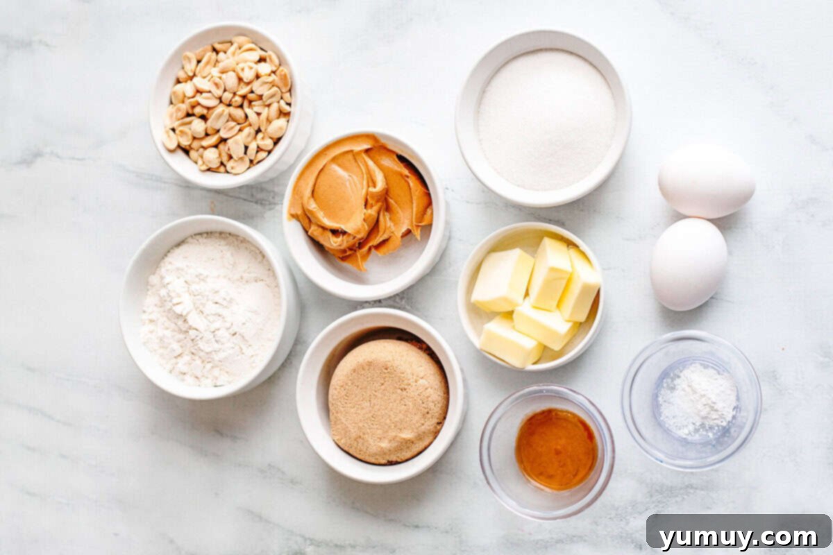 A collection of bowls displaying all the measured ingredients for peanut butter blondies