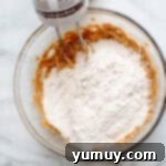 mixing dry ingredients into batter