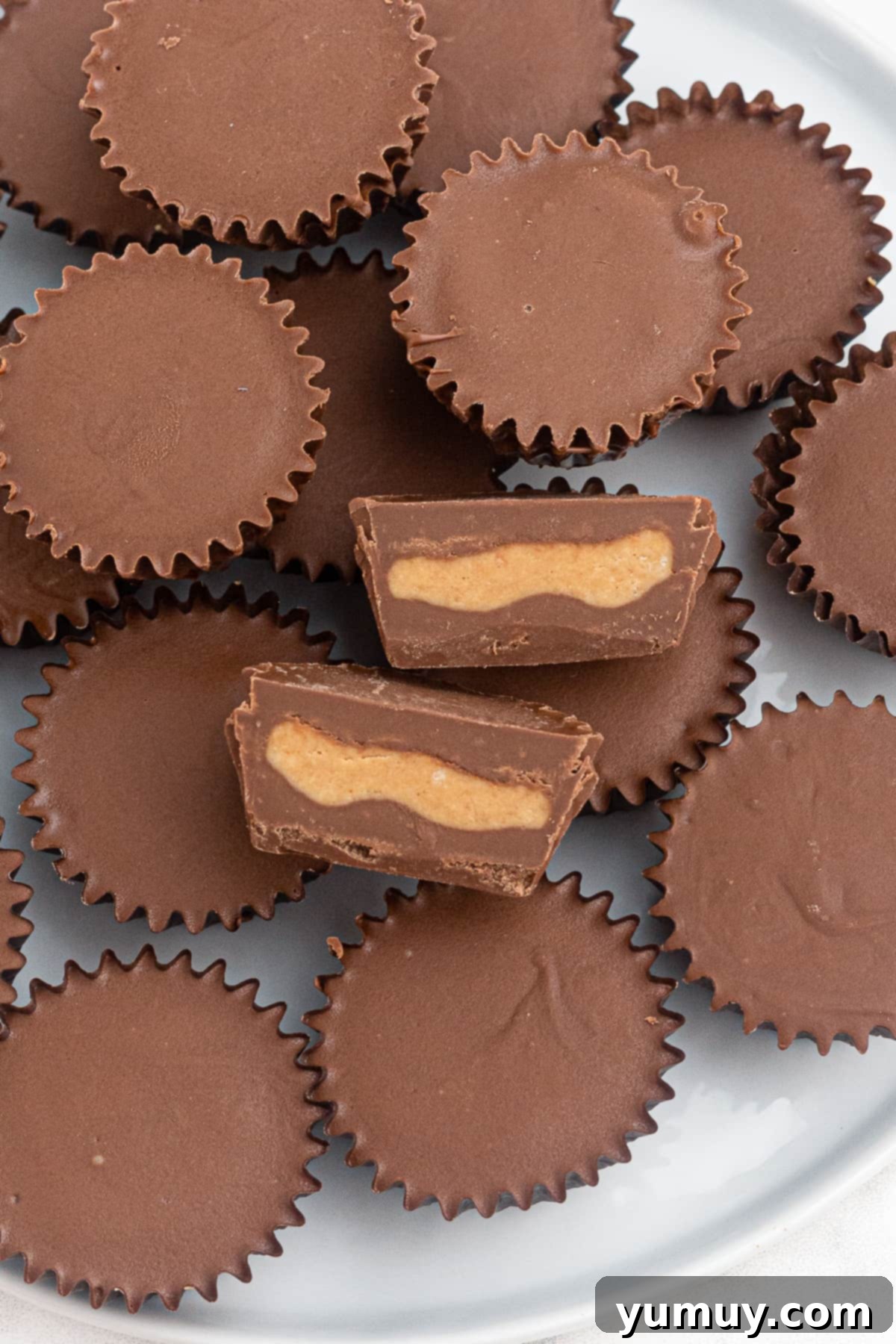 Delicious homemade peanut butter cups displayed on a white plate, ready to be enjoyed.