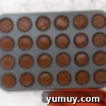 Homemade peanut butter cups cooling and setting.