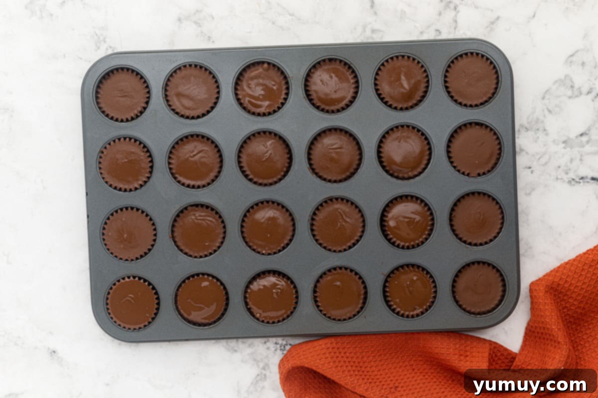 Step 7: Finished homemade peanut butter cups in a muffin tin, fully set.