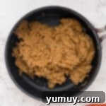 Mixing peanut butter filling ingredients for the cups.