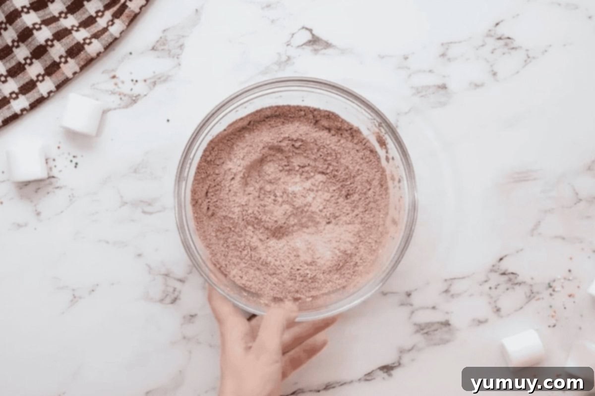 dry ingredients for hot chocolate cookies in a glass bowl.