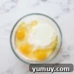 ingredients for lemon cupcakes in a glass bowl.