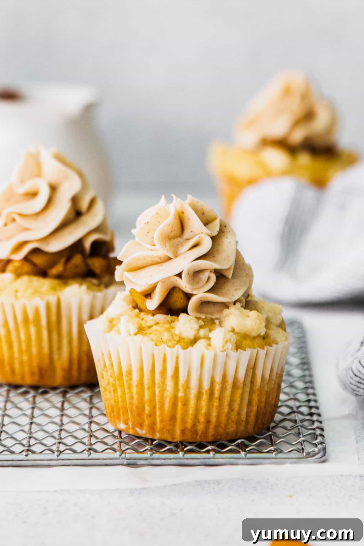 Golden Apple Crumb Cupcakes 2 apple pie cupcakes on cooling rack