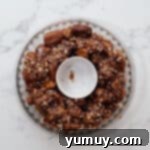 Instant Monkey Bread Delight 12 Microwave monkey bread in the pie pan, topped with pecans and ready to be cooked.