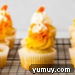 candy corn cupcakes on cooling rack