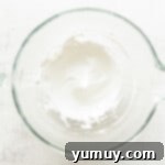 Whipped egg whites in a bowl.