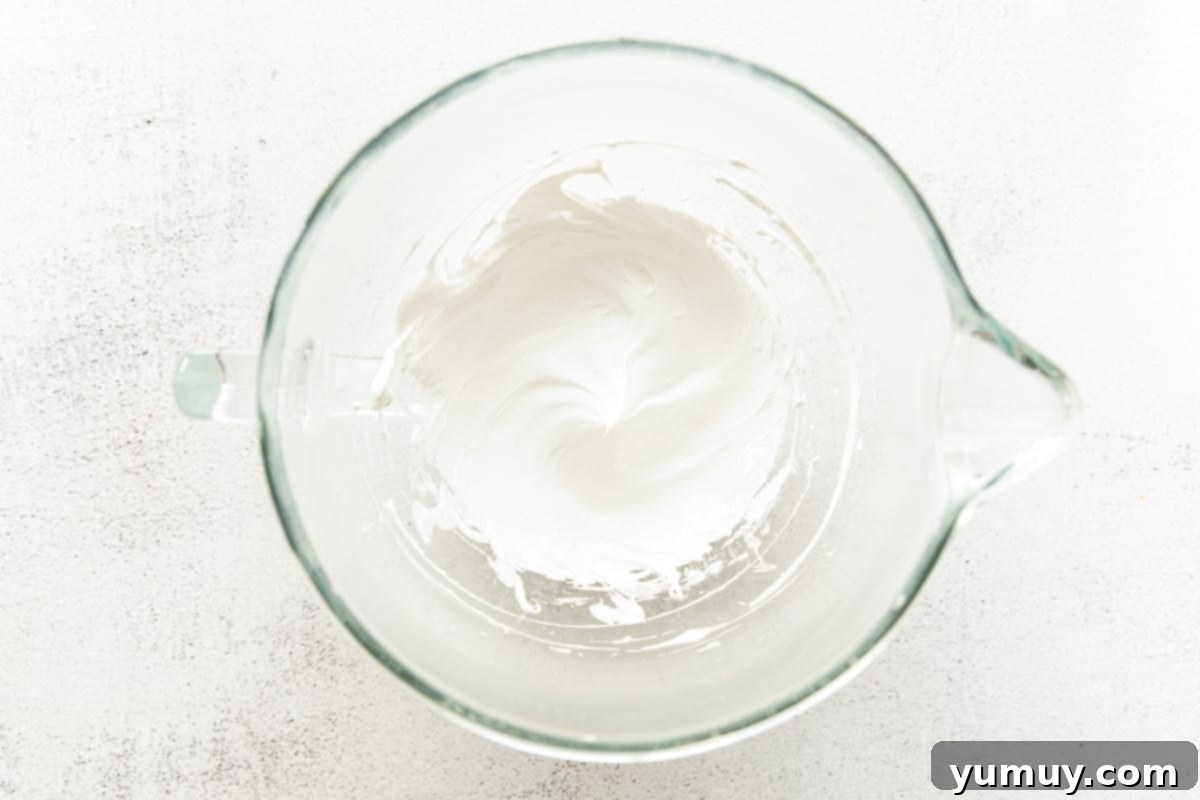 Whipped egg whites in a bowl.