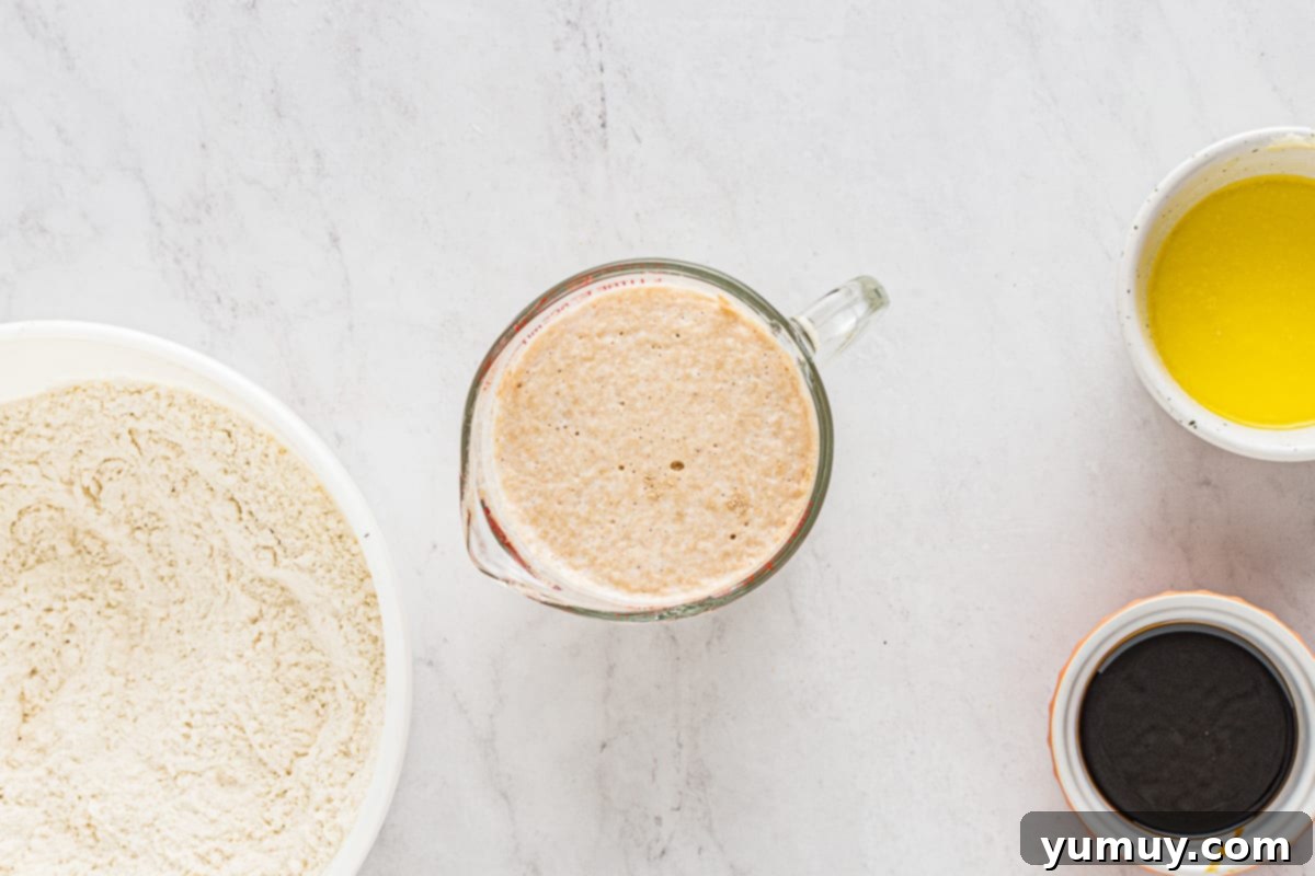 Enchanted Halloween Loaves 15 Yeast blooming in a measuring cup.