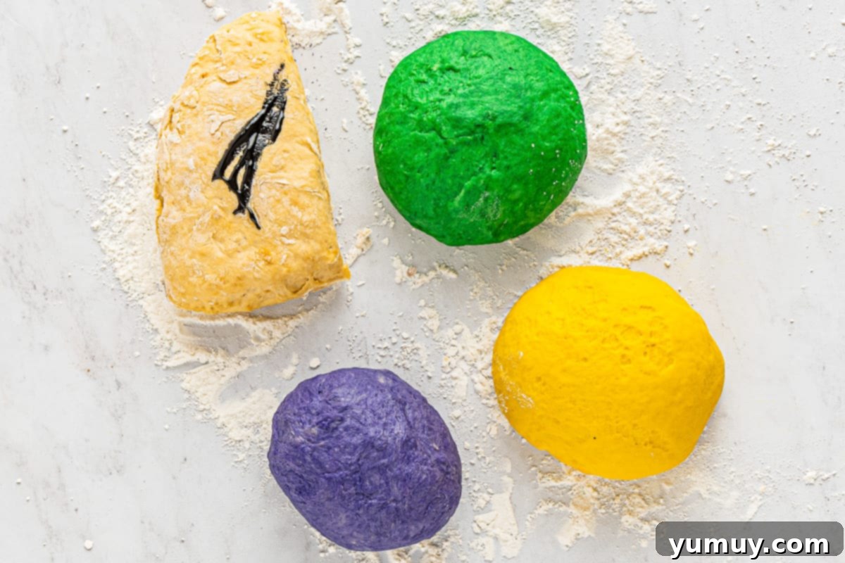 Enchanted Halloween Loaves 17 Bread dough separated into 4 portions, each dyed a different color.