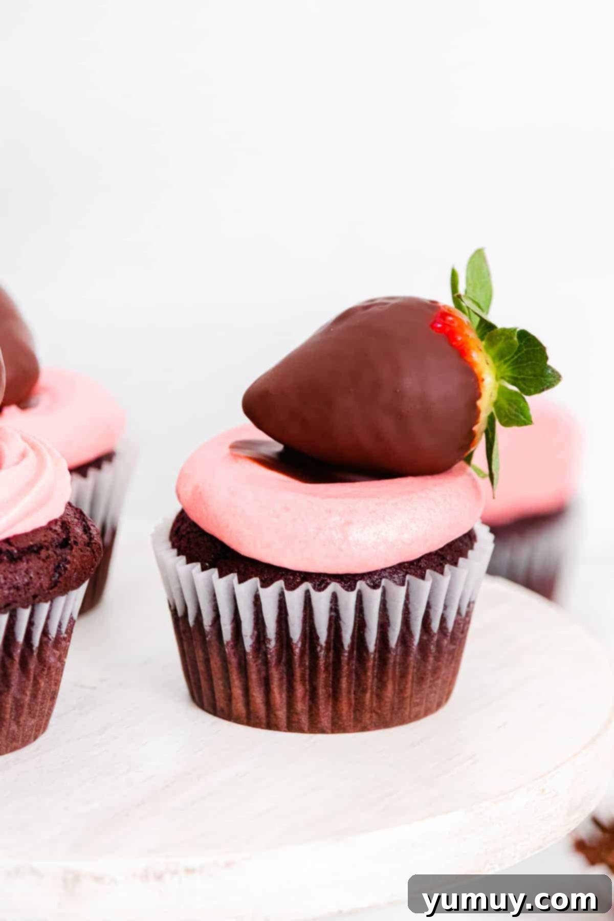 chocolate covered strawberry cupcakes on cake stand