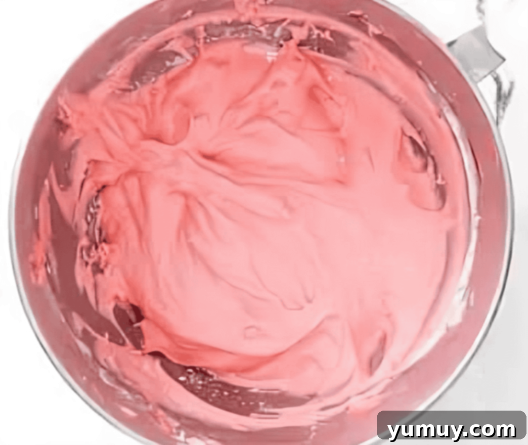 strawberry frosting in a mixing bowl.