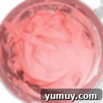 strawberry frosting in a mixing bowl.