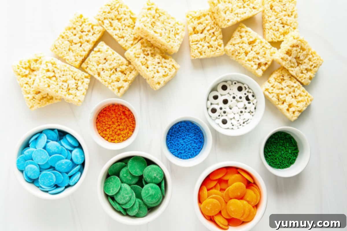 Ingredients for Halloween Rice Krispie treat monsters laid out, including unwrapped Rice Krispie treats and colorful sprinkles.